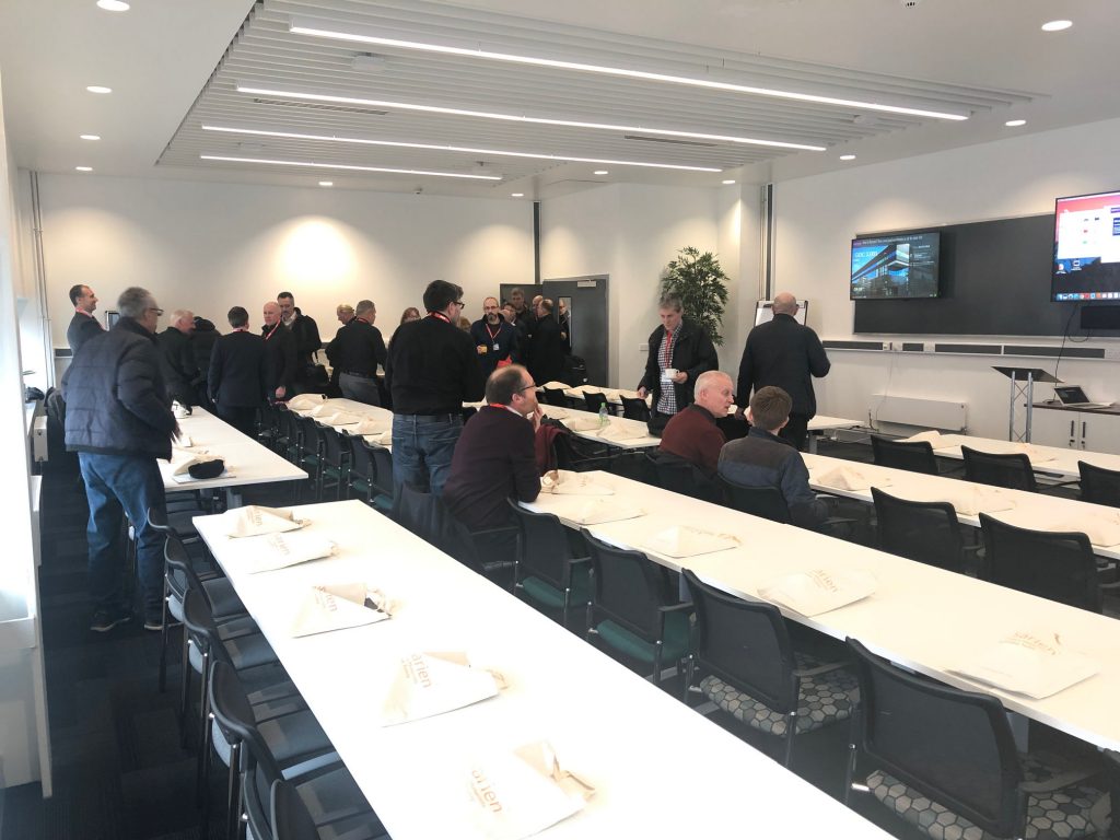 Versarien shareholders filing into the GEIC conference room
